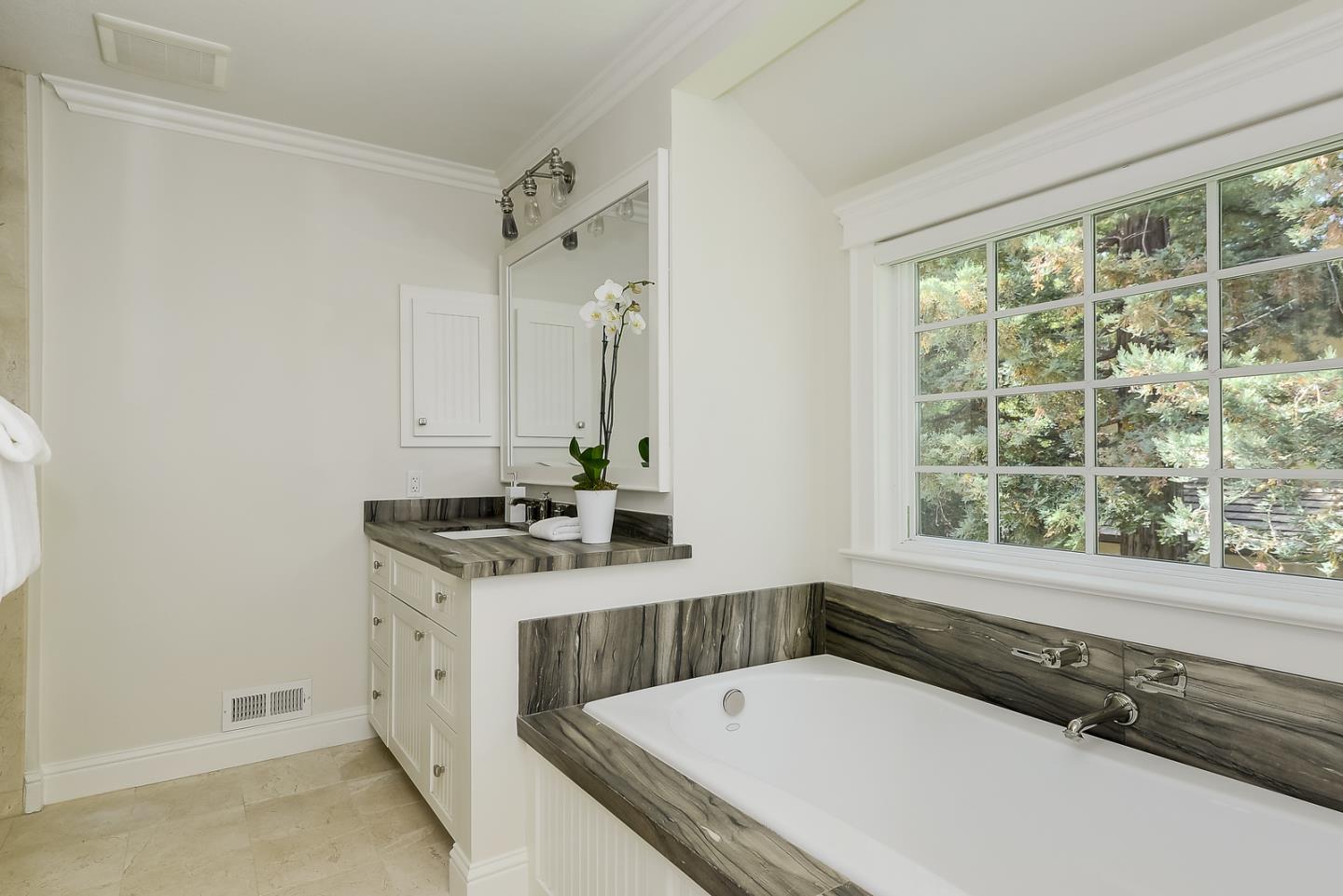 277 Delphi Circle Los Altos, CA 94022 - Photo 23 of 28 a bathroom with a tub and a sink