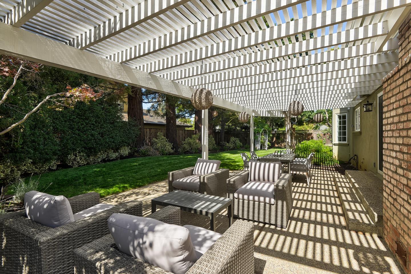 277 Delphi Circle Los Altos, CA 94022 - Photo 26 of 28 a view of a patio with couches table and chairs and garden