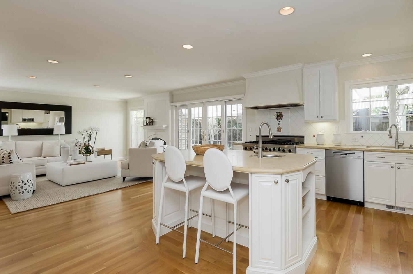 277 Delphi Circle Los Altos, CA 94022 - Photo 7 of 28 a kitchen with white cabinets and chairs