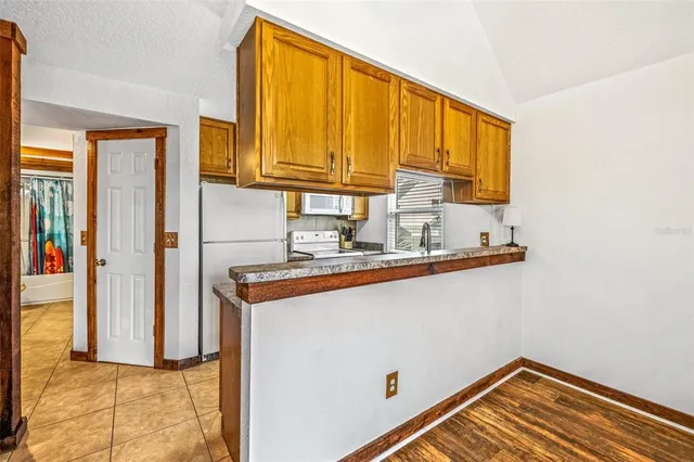 a kitchen that has a sink and a stove