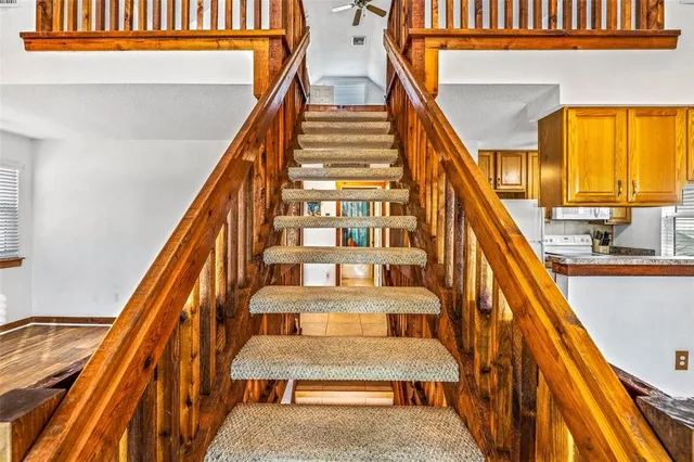 a view of a room with wooden floor and window