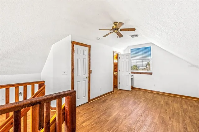 a view of a hallway with stairs