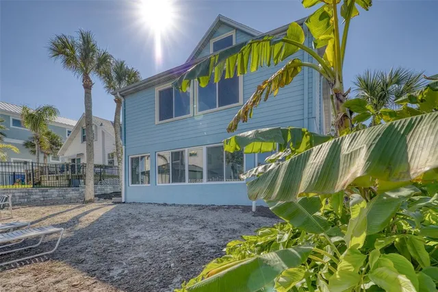 a view of a house with a backyard and a patio