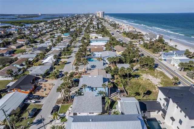 an aerial view of beach and ocean