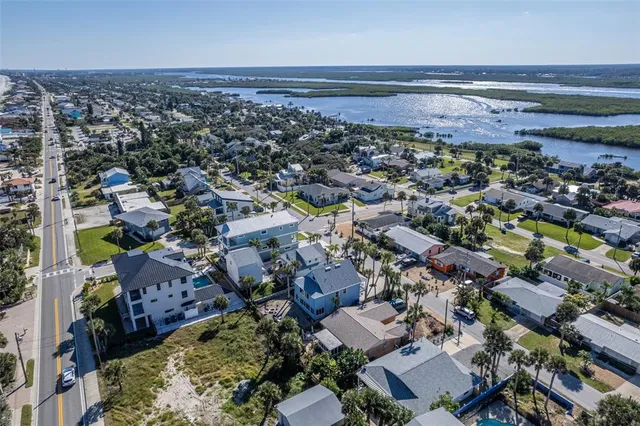 an aerial view of a beach and ocean view
