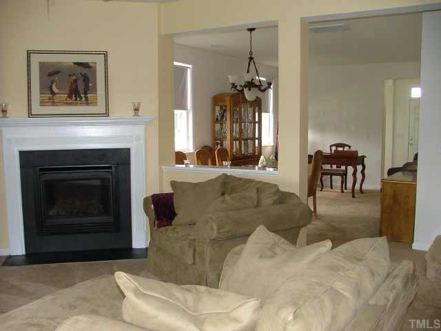 100 Cupp Court Raleigh, NC 27603 - Photo 2 of 10 Relax in the spacious family room with fireplace. First floor has 9 foot ceilings. Other