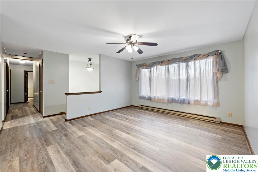3006 Beddall Street Slatington, PA 18080 - Photo 6 of 31 a view of n empty room with window and wooden floor