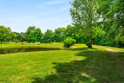 a view of a golf course with a lake