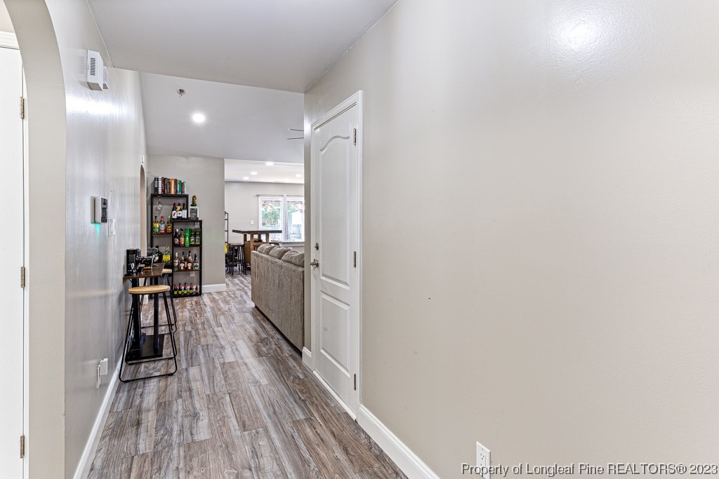 634 Broad Drive Raeford, NC 28376 - Photo 13 of 31 a kitchen with a refrigerator and wooden floor