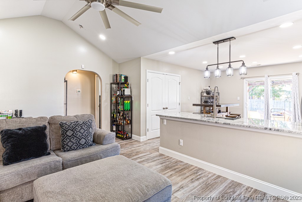 634 Broad Drive Raeford, NC 28376 - Photo 17 of 31 a living room with furniture and chandelier