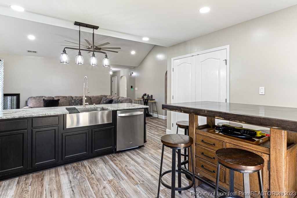 634 Broad Drive Raeford, NC 28376 - Photo 20 of 31 a kitchen with a sink stainless steel appliances and cabinets
