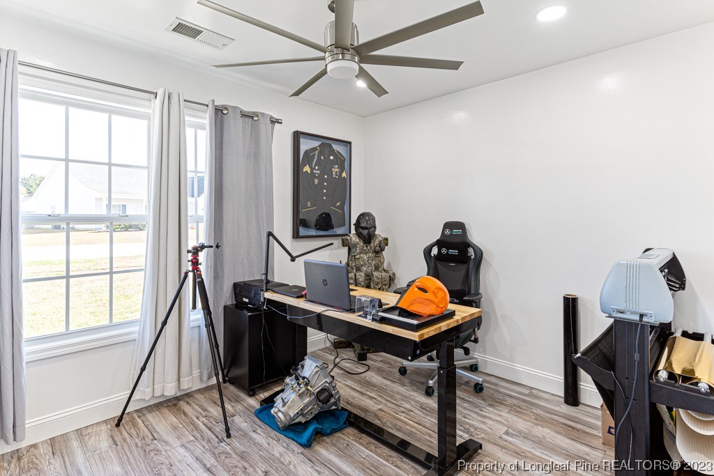 634 Broad Drive Raeford, NC 28376 - Photo 23 of 31 a room with furniture and wooden floor