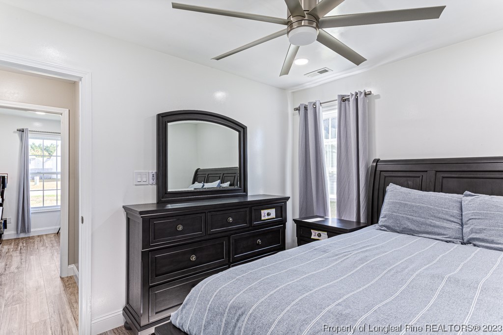 634 Broad Drive Raeford, NC 28376 - Photo 27 of 31 a bedroom with a bed and a dresser