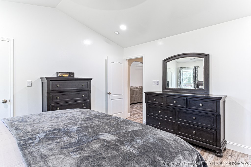 634 Broad Drive Raeford, NC 28376 - Photo 30 of 31 a bedroom with a bed and a dresser
