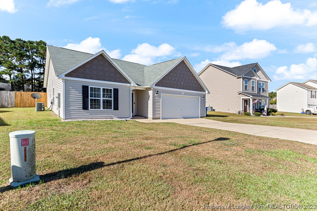 634 Broad Drive Raeford, NC 28376 - Photo 3 of 31 a front view of a house with a yard