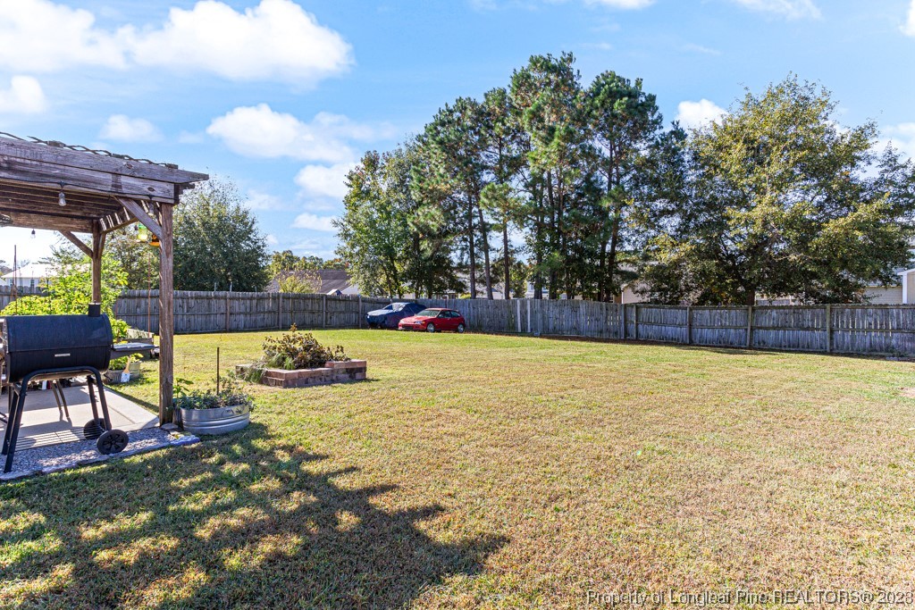 634 Broad Drive Raeford, NC 28376 - Photo 5 of 31 a view of yard with swimming pool and sitting area