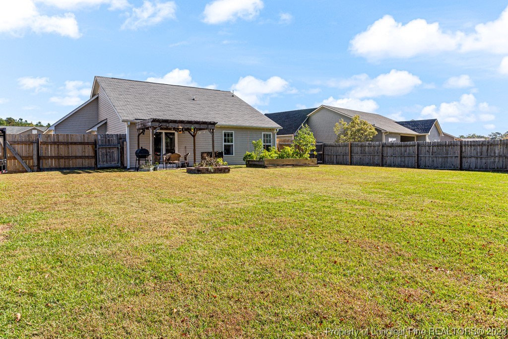 634 Broad Drive Raeford, NC 28376 - Photo 6 of 31 a large house with a big yard and large trees