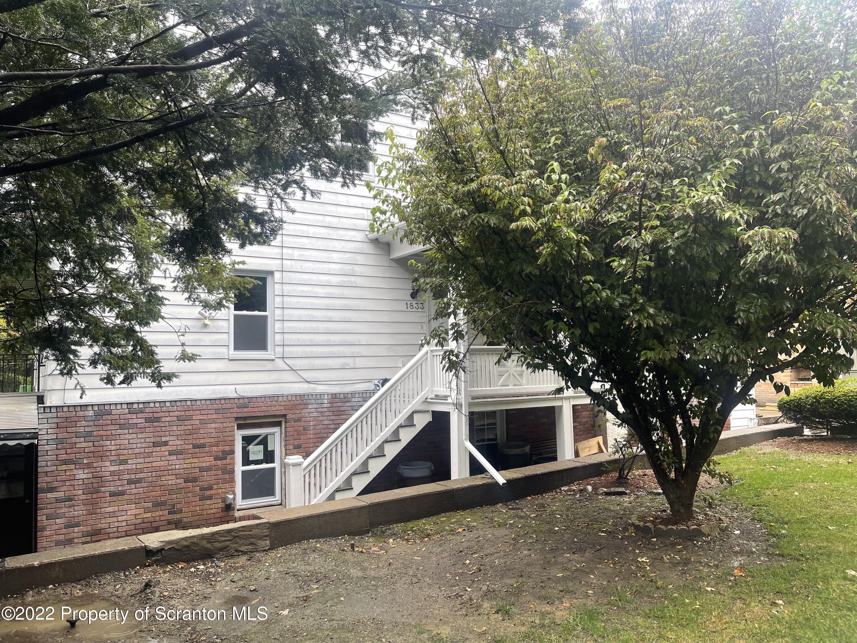 1833 South Webster Avenue Scranton, PA 18505 - Photo 1 of 17 a view of a house with a yard