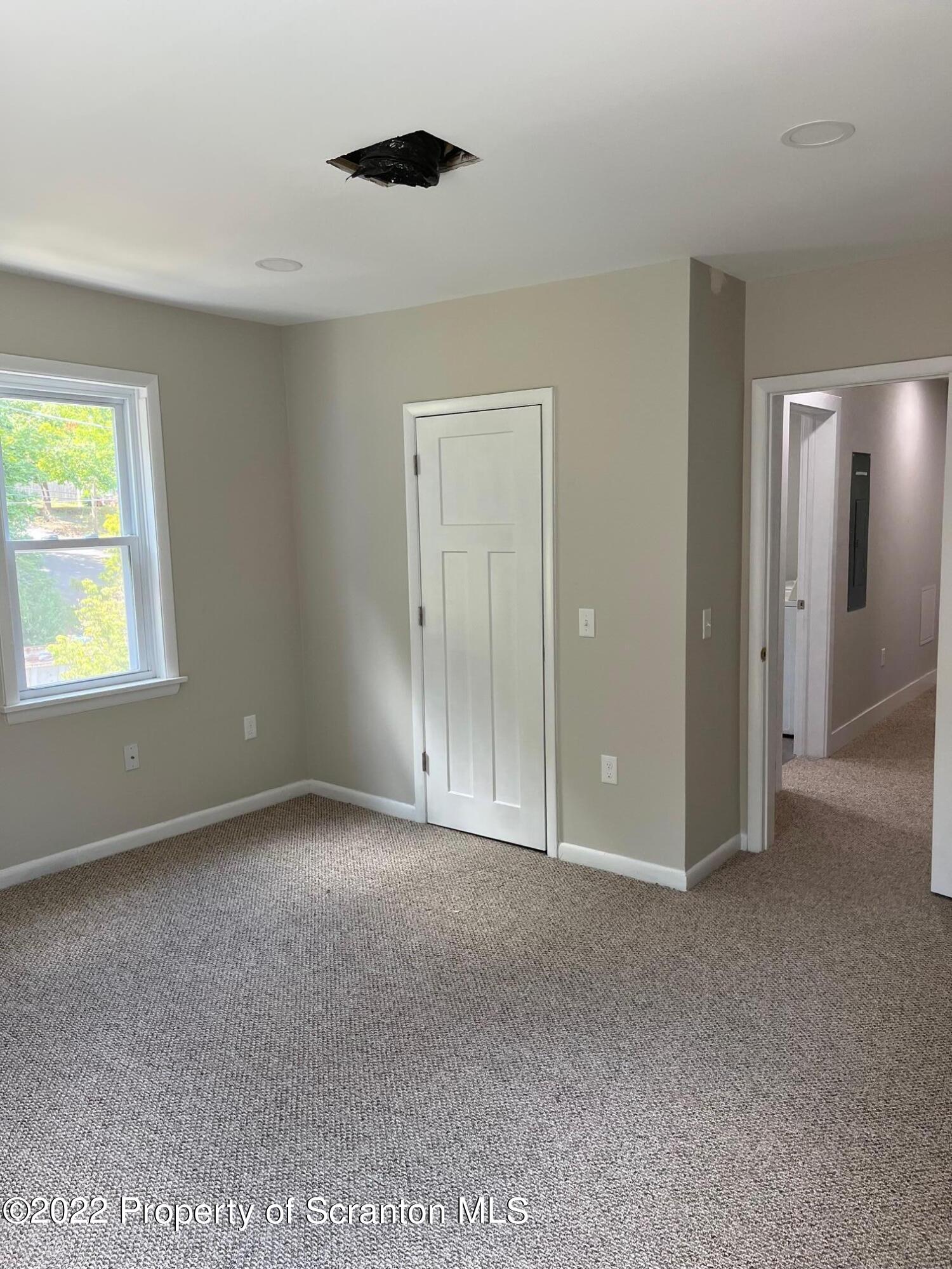 1833 South Webster Avenue Scranton, PA 18505 - Photo 12 of 17 a view of an empty room with a window