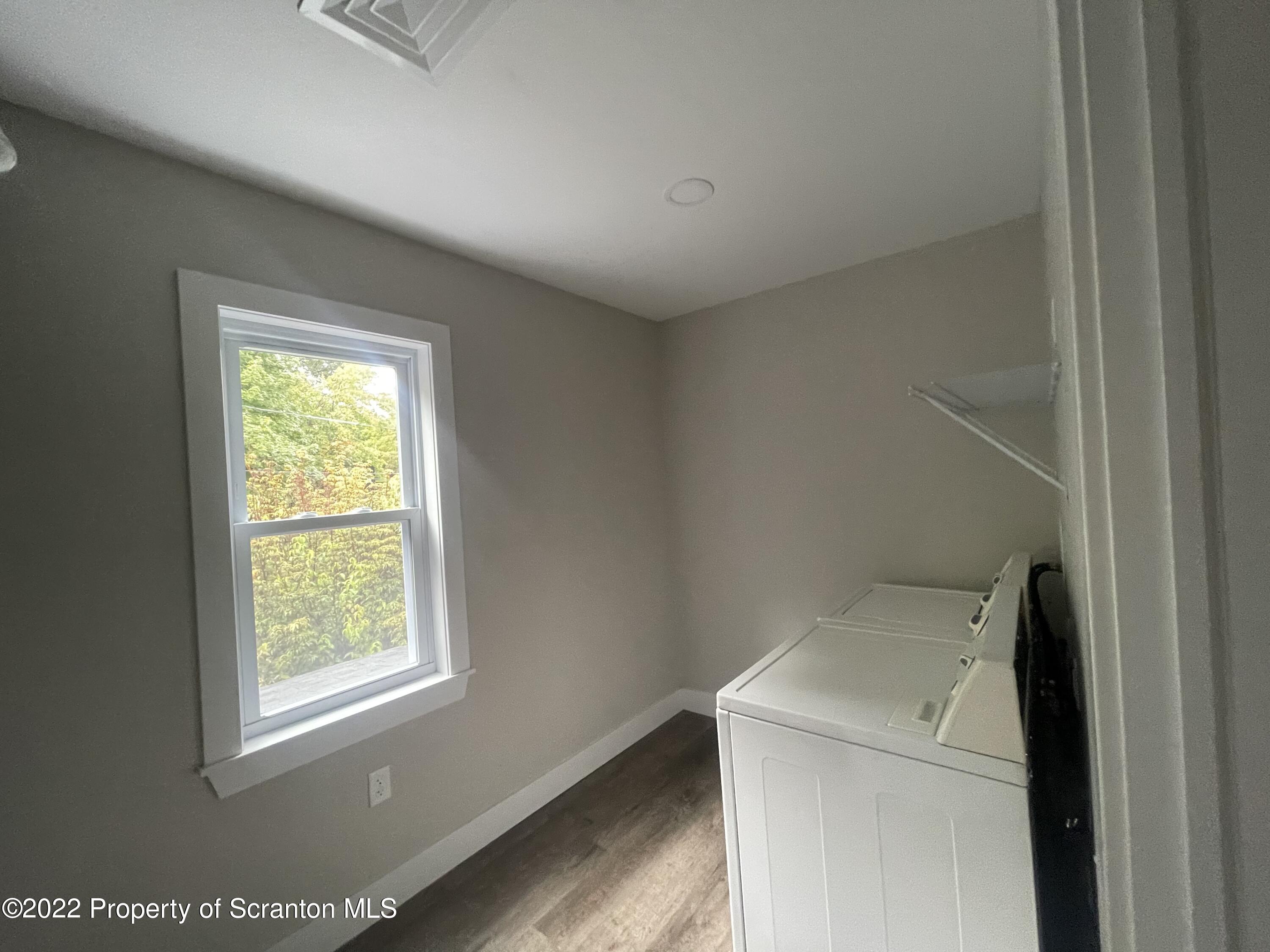 1833 South Webster Avenue Scranton, PA 18505 - Photo 15 of 17 a utility room with dryer and window