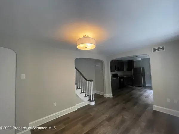 a view of a livingroom with a furniture and a fireplace