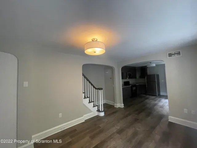a view of a livingroom with a furniture and a fireplace