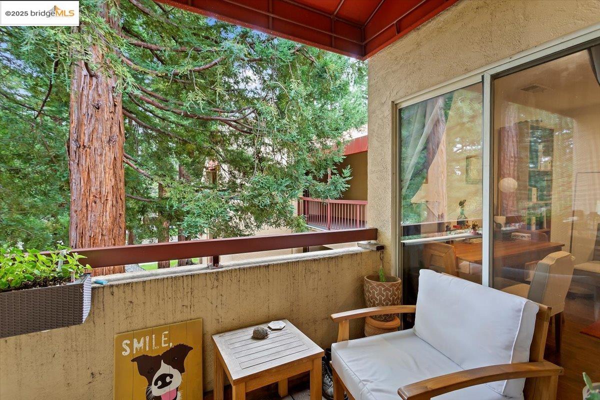 1308 Walden Road, Unit 32 Walnut Creek, CA 94597 - Photo 12 of 43 a balcony with couple of chairs and a potted plant