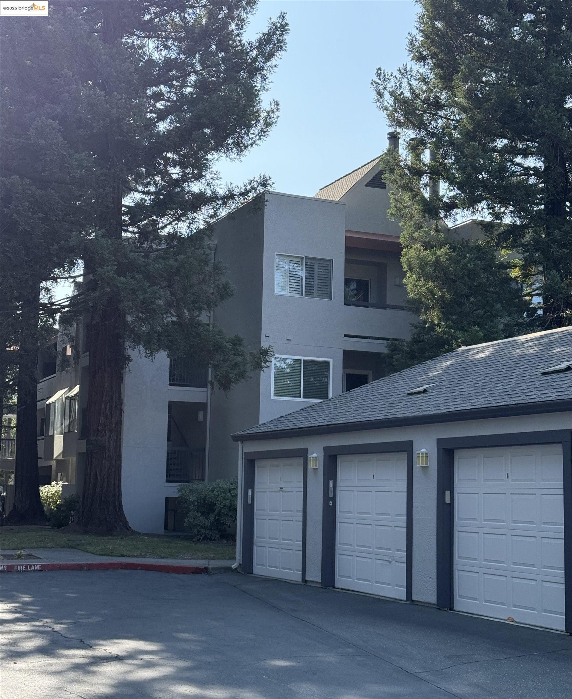 1308 Walden Road, Unit 32 Walnut Creek, CA 94597 - Photo 27 of 43 a front view of a house with a yard
