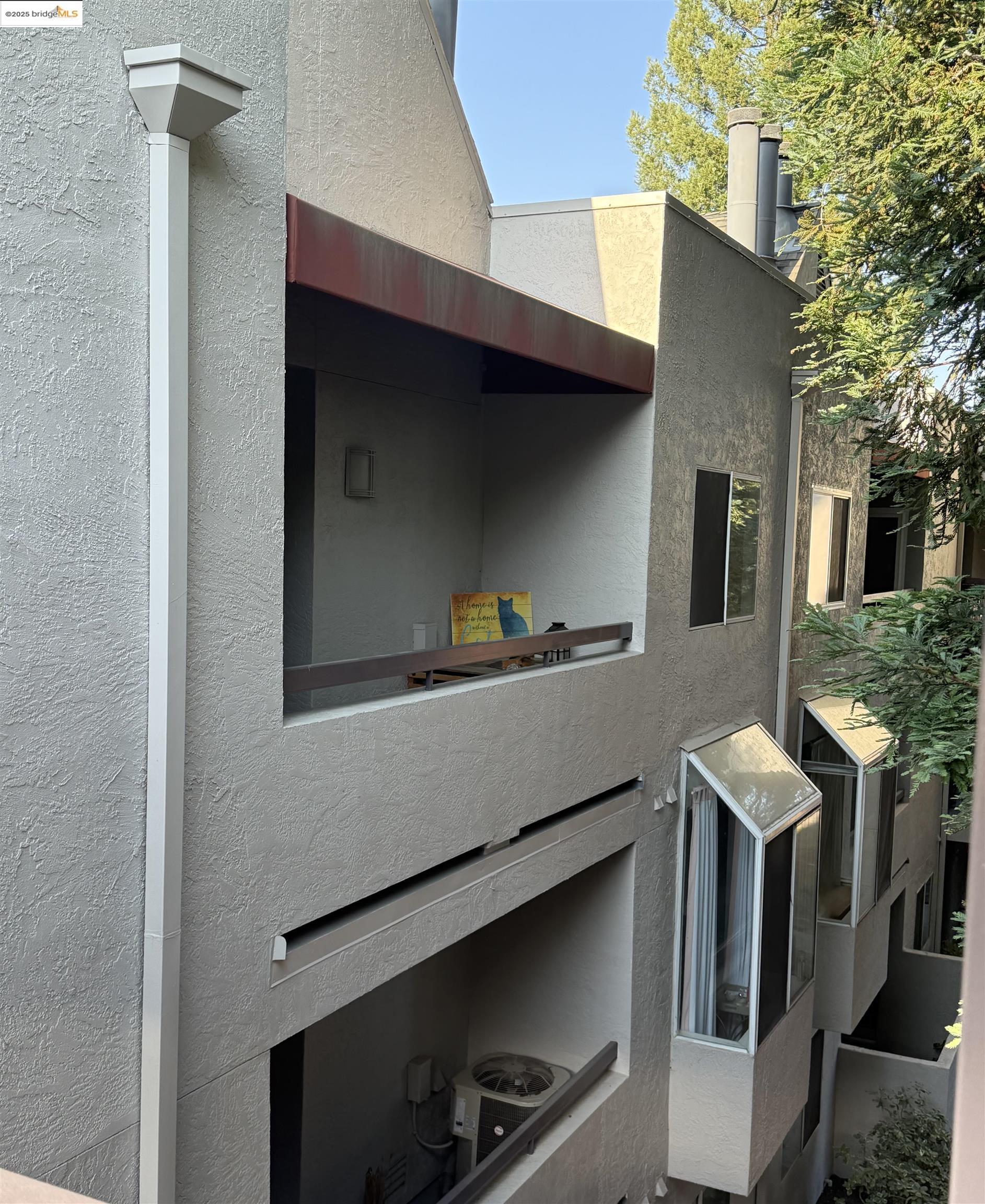 1308 Walden Road, Unit 32 Walnut Creek, CA 94597 - Photo 29 of 43 a living room with furniture and a potted plant