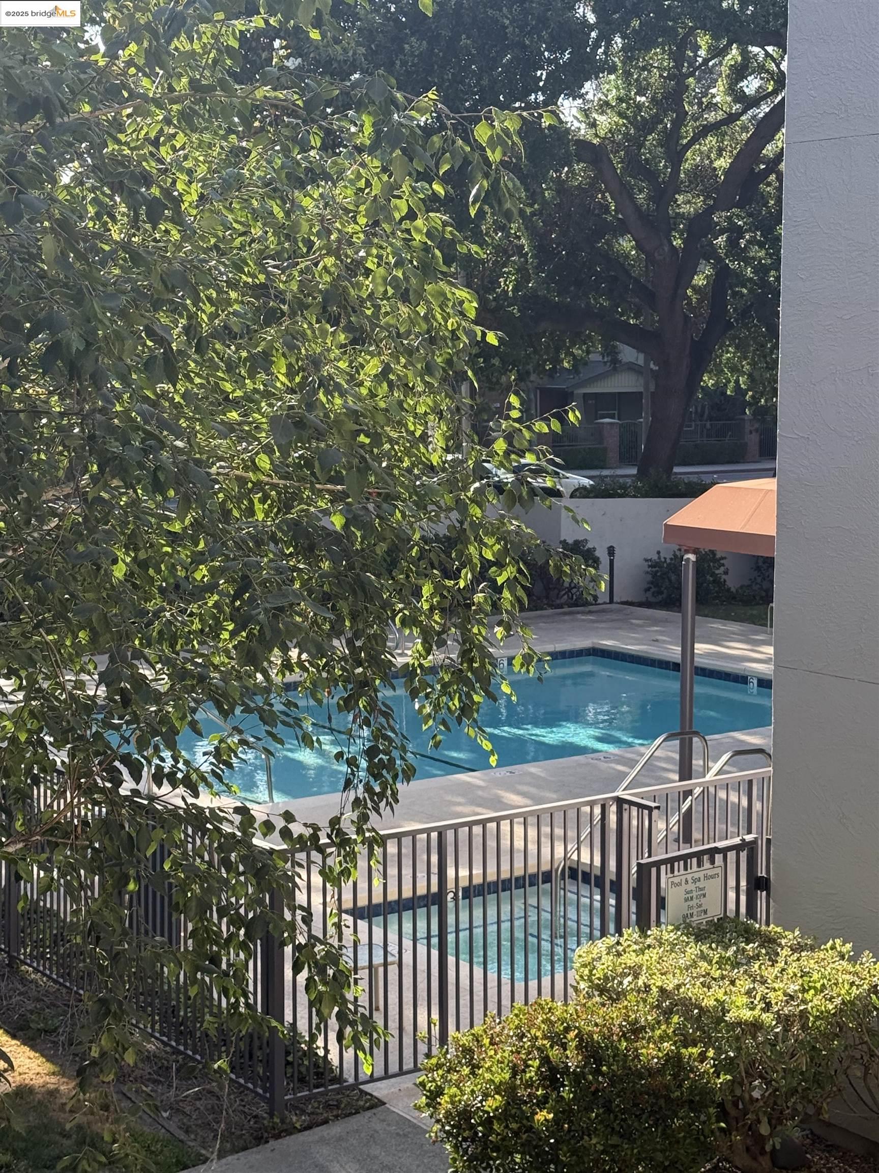 1308 Walden Road, Unit 32 Walnut Creek, CA 94597 - Photo 40 of 43 a view of a wooden deck with a bench