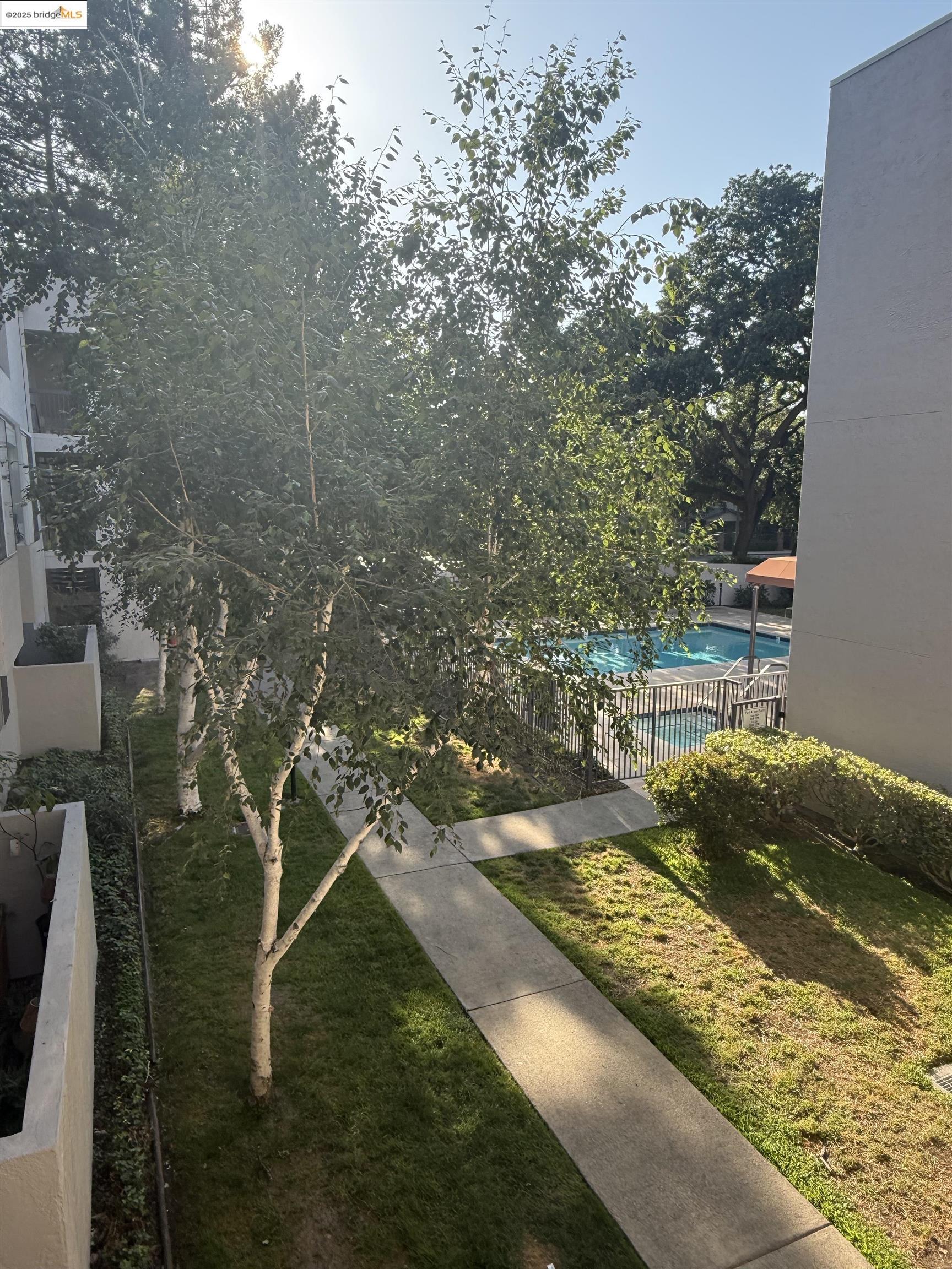 1308 Walden Road, Unit 32 Walnut Creek, CA 94597 - Photo 42 of 43 a view of a lake with a yard