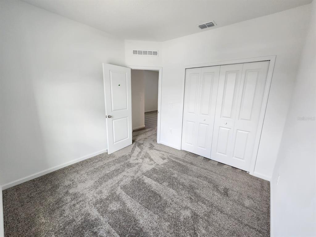 3258 Laurent Loop Davenport, FL 33837 - Photo 11 of 26 a view of an empty room