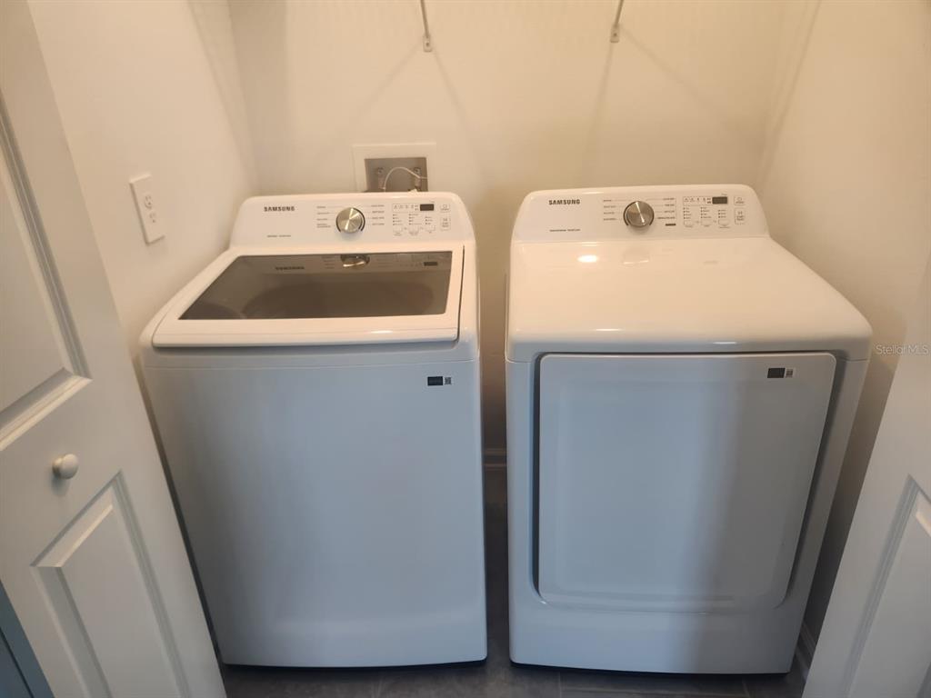3258 Laurent Loop Davenport, FL 33837 - Photo 12 of 26 a utility room with dryer and washer