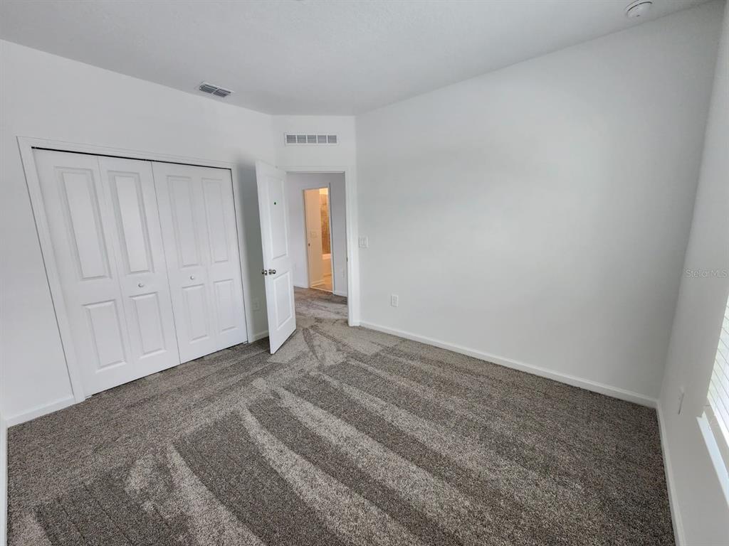 3258 Laurent Loop Davenport, FL 33837 - Photo 13 of 26 a view of an empty room