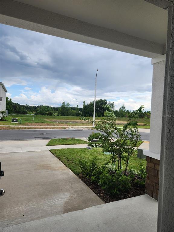 3258 Laurent Loop Davenport, FL 33837 - Photo 19 of 26 a view of a lake with a big yard