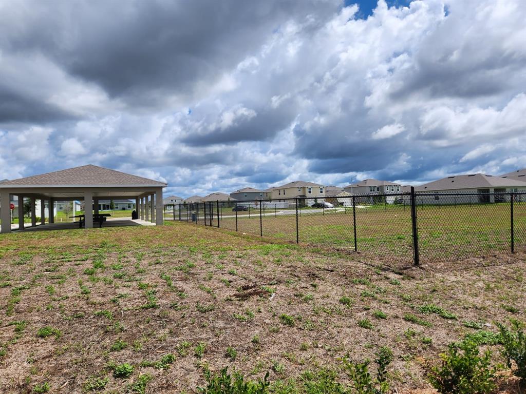 3258 Laurent Loop Davenport, FL 33837 - Photo 22 of 26 a view of a house with a yard