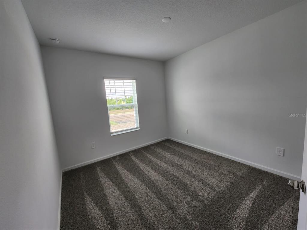 3258 Laurent Loop Davenport, FL 33837 - Photo 10 of 26 a view of an empty room and window