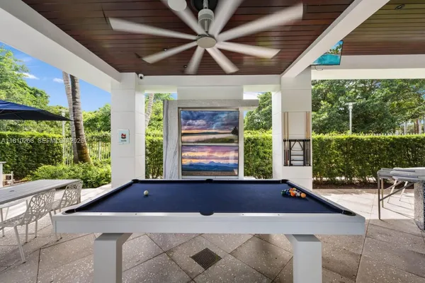 a view of a patio with a table and chairs