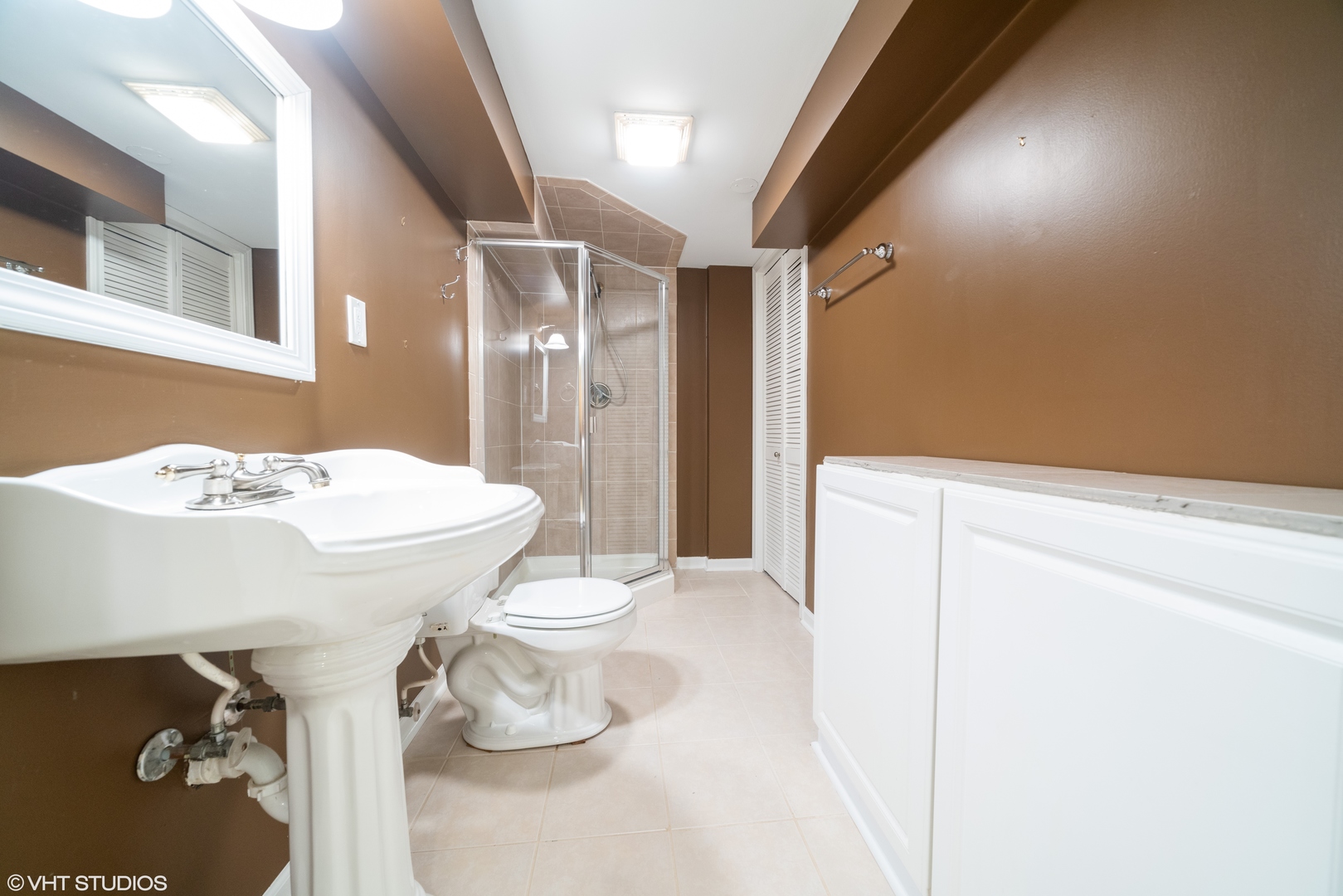 1675 Valley Forge Court, Unit E Wheaton, IL 60189 - Photo 11 of 11 a bathroom with a sink toilet and shower