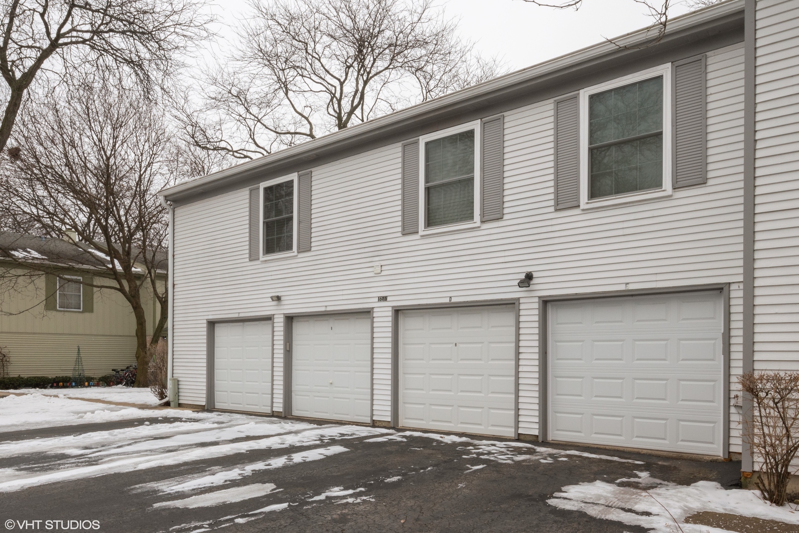 1675 Valley Forge Court, Unit E Wheaton, IL 60189 - Photo 3 of 11 a front view of a house