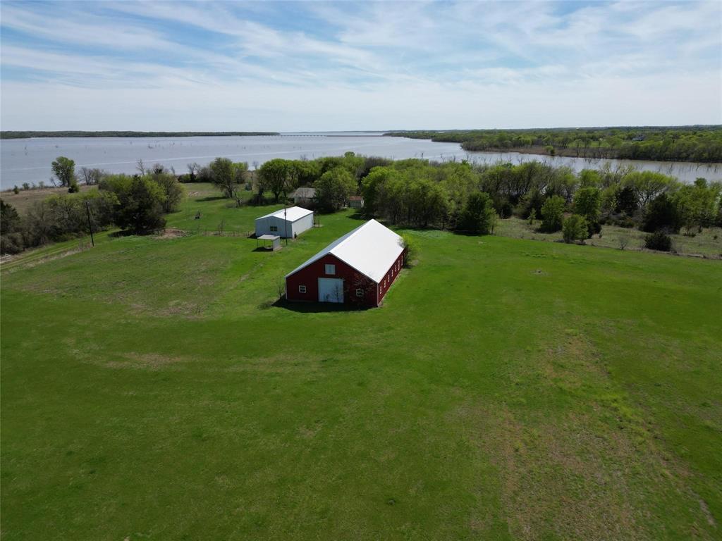 2109 Triangle Road Valley View, TX 76272 - Photo 3 of 7 a view of a lake with a yard