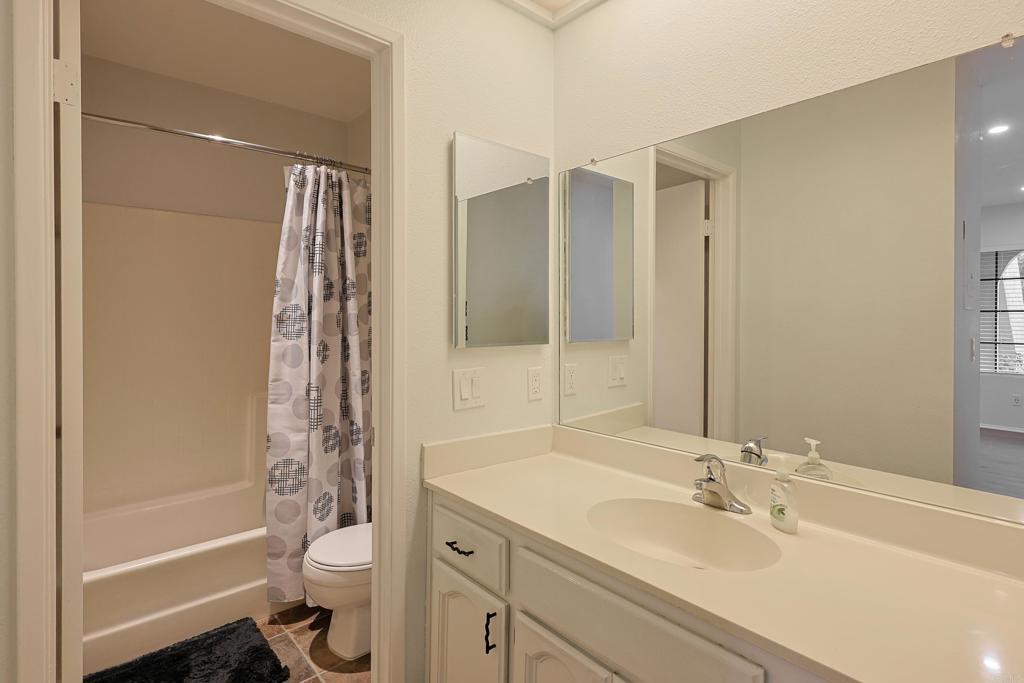 8612 Arminda Circle, Unit 51 Santee, CA 92071 - Photo 12 of 55 a bathroom with a sink toilet and shower