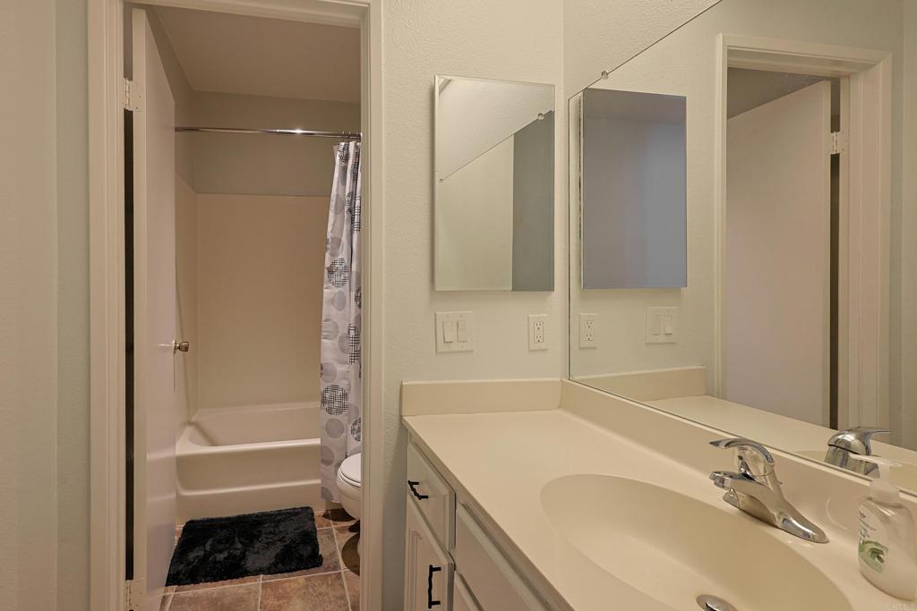 8612 Arminda Circle, Unit 51 Santee, CA 92071 - Photo 13 of 55 a bathroom with a sink and a mirror