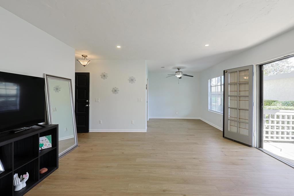 8612 Arminda Circle, Unit 51 Santee, CA 92071 - Photo 15 of 55 a view of a livingroom with wooden floor and a flat screen tv
