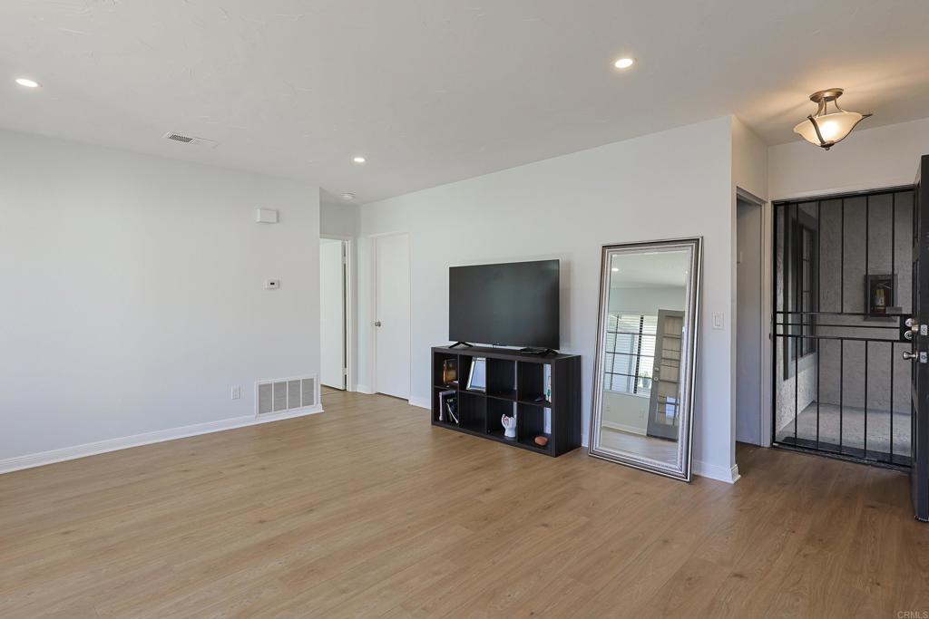 8612 Arminda Circle, Unit 51 Santee, CA 92071 - Photo 19 of 55 a view of a livingroom with a flat screen tv with wooden floor