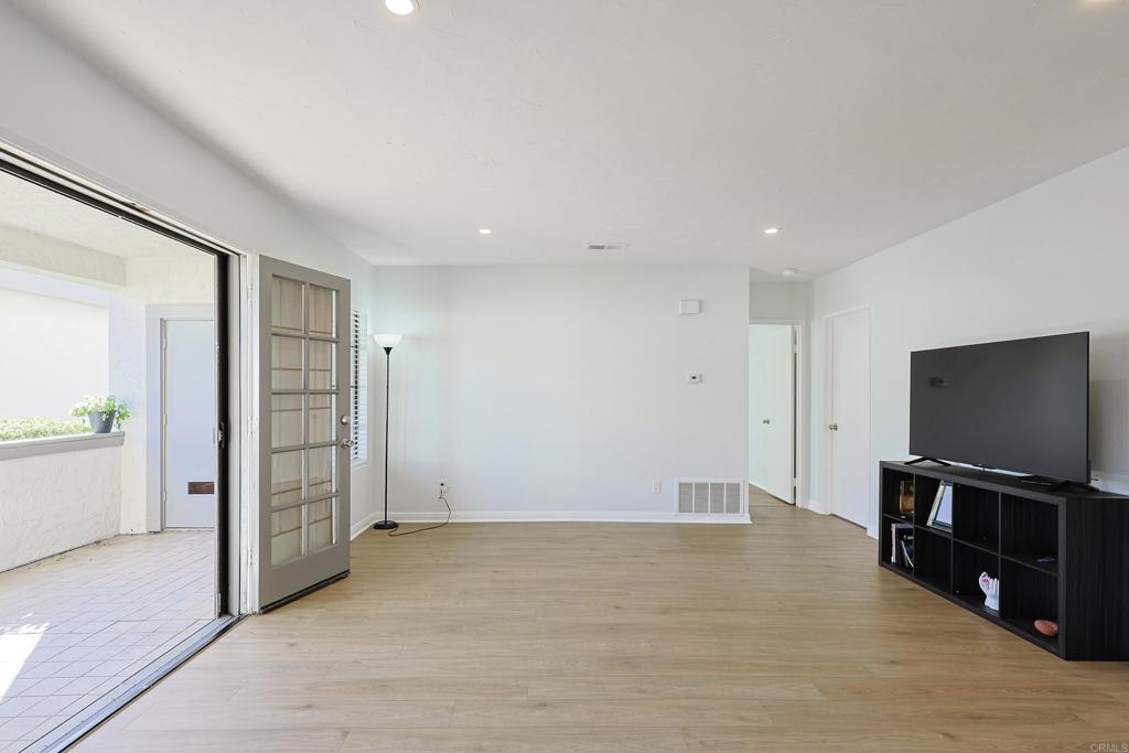 8612 Arminda Circle, Unit 51 Santee, CA 92071 - Photo 20 of 55 a view of a livingroom with wooden floor and a flat screen tv