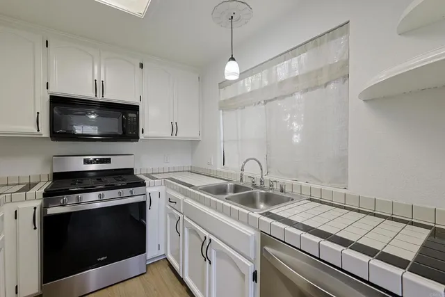 a spacious bedroom with a bed and window