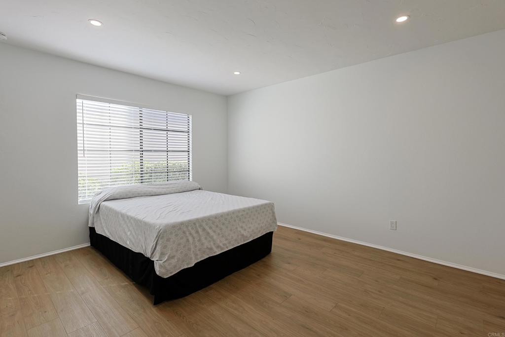 8612 Arminda Circle, Unit 51 Santee, CA 92071 - Photo 29 of 55 a spacious bedroom with a bed and window