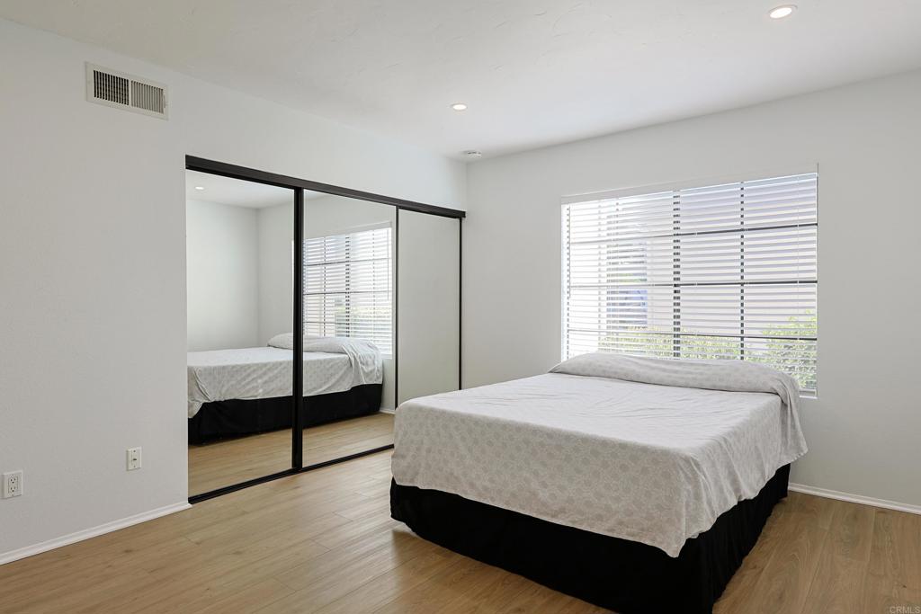 8612 Arminda Circle, Unit 51 Santee, CA 92071 - Photo 32 of 55 a bedroom with a bed and a window