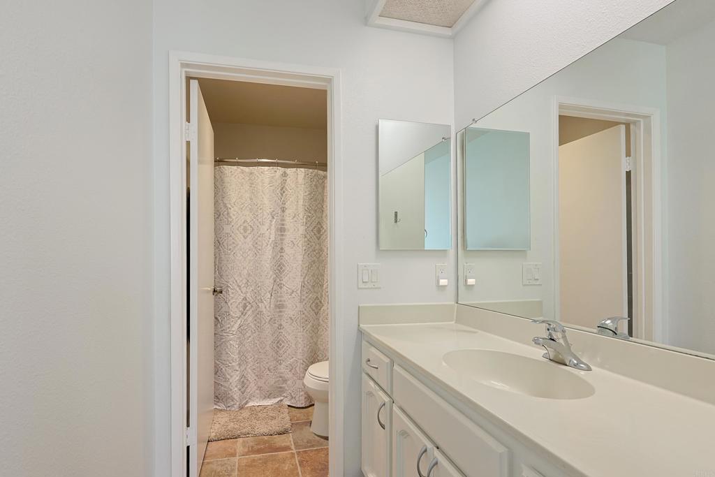 8612 Arminda Circle, Unit 51 Santee, CA 92071 - Photo 34 of 55 a bathroom with a granite countertop sink toilet and shower